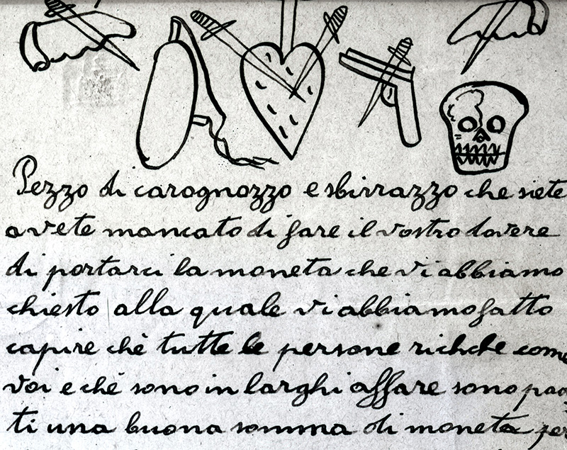 A sample extortion letter from the Black Hand. "“You dog, spy, informer. If you do not do what we say, we have a shot gun prepared for you. What a fine feast for the rats your fat carcass will make. Do what we say, it will be better for your skin.” (Courtesy the National Law Enforcement Museum)