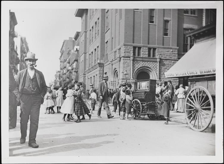 Children dancing on Mulberry Street as a man plays a barrel organ. (No monkey in sight!) 1897 (Courtesy Museum of the City of New York)