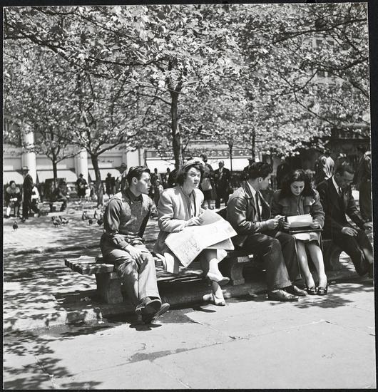 This photo was taken by Stanley Kubrick during his years as a photographer for Look Magazine. The caption reads "Park Bench Nuisance [Woman reading a newspaper, while a man reads over her shoulder.]" Courtesy Museum of the City of New York