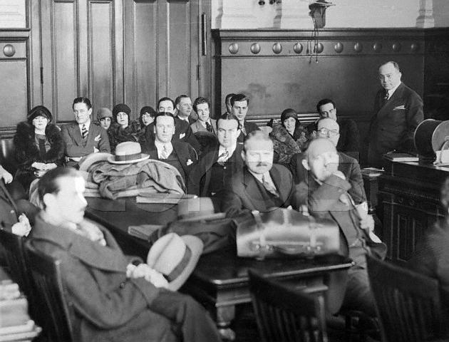 Original caption: Cast of Tried By Jury. New York, New York: Photo shows scene in courtroom of general sessions part II at start of members of company. Mae West and Barry O'Niel, in productions leading roles, can be seen at extreme left. March 28, 1927 New York, New York, USA