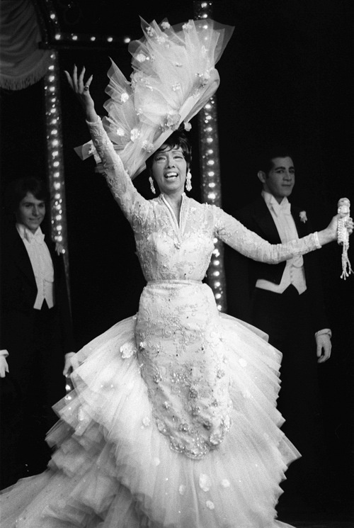 US-born dancer Josephine Baker, nicknamed Black Venus, performs 26 March 1975 at a Paris'stage Bobino, two weeks before her death 10 April 1975. Baker, born 03 June 1906 in St. Louis, Missouri, first danced for the public on the streets of St. Louis and in the Booker T. Washington Theater, a black vaudeville house in her native town. Later she became a chorus girl. Her first job in Paris was in La Revue Negre at Folies Bergeres in 1925, where she first performed her famous banana dance. In 1937 she renounced her American citizenship and became a citizen of France. During WWII, Josephine Baker worked as a spy for the French resistance and became sub-lieutenant in the Women's Auxiliary of the French Air Force. Baker was back in France in 1954, with the intention of raising a family o ethnically diverse children that she had brought to France from her tours around the world. In her last years, Baker suffered struggles, financial difficulties, and poor health. (Photo credit should read PIERRE GUILLAUD/AFP/Getty Images)